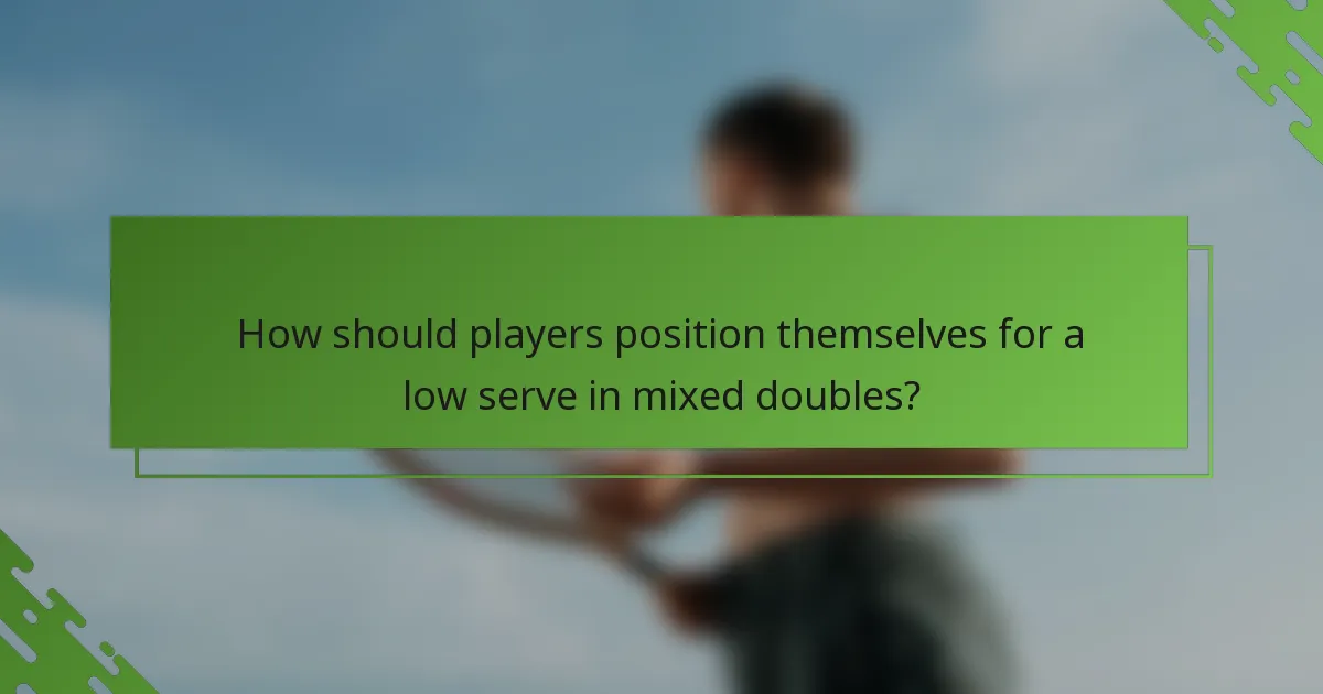 How should players position themselves for a low serve in mixed doubles?